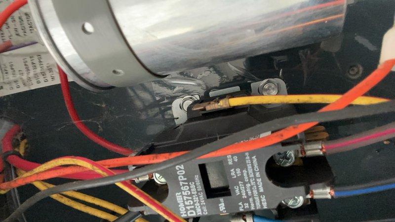 Responded to no cooling complaint on 6-year-old unit where compressor was humming but not starting after circuit breaker tripped. Upon inspection, found compressor locked rotor condition with failed start capacitor preventing proper startup. Replaced defective run/start capacitor, verified proper voltage at contactor, and tested compressor operation. Unit restored to normal cooling operation with compressor running smoothly and proper amperage draw confirmed.
