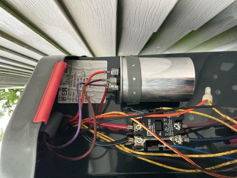 Responded to no cooling complaint on 6-year-old unit where compressor was humming but not starting after circuit breaker tripped. Upon inspection, found compressor locked rotor condition with failed start capacitor preventing proper startup. Replaced defective run/start capacitor, verified proper voltage at contactor, and tested compressor operation. Unit restored to normal cooling operation with compressor running smoothly and proper amperage draw confirmed.