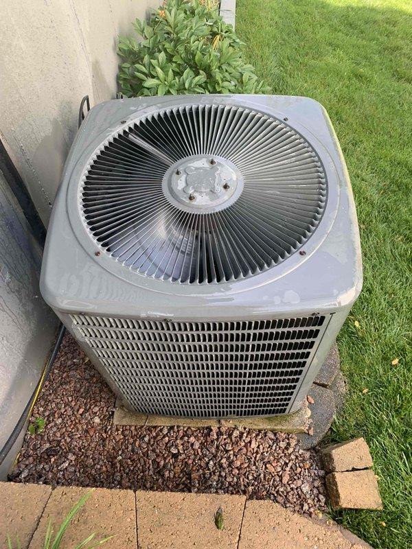 Completed cooling system tune-up and preventative maintenance on 16-year-old outdoor condenser unit. Performed comprehensive inspection of heat exchanger coils, which showed moderate dirt and debris accumulation between aluminum fins requiring attention. Evaluated overall unit operation, checked refrigerant levels, tested electrical connections, inspected fan motor and blade assembly, and verified proper airflow through ventilation slats. Unit operational upon completion with recommendations provided for ongoing maintenance to ensure optimal efficiency.