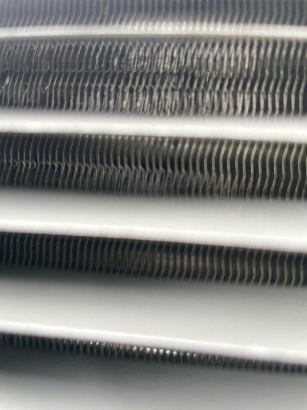 Completed return visit to residential property to finalize diagnostics and repairs that were postponed due to inclement weather during initial service call. Performed comprehensive inspection of outdoor condensing unit, verified heat exchanger and evaporator coil condition showing clean fins with proper spacing and alignment, and documented equipment operation. Unit found in satisfactory operating condition with no accessibility issues noted.