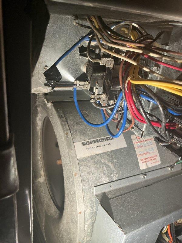 Responded to no cooling complaint with reported refrigerant leak. Upon arrival, accessed indoor unit compartment and inspected electrical connections and wiring harness. Connected Fieldpiece digital manifold gauges to outdoor condensing unit service ports to evaluate system pressures and diagnose refrigerant circuit performance. Measured operating pressures on both high and low sides using calibrated gauges with standard refrigerant hoses. Based on pressure readings and visual inspection, confirmed refrigerant system issue affecting cooling capacity. Documented equipment condition and diagnostic findings with photographic evidence for service records.