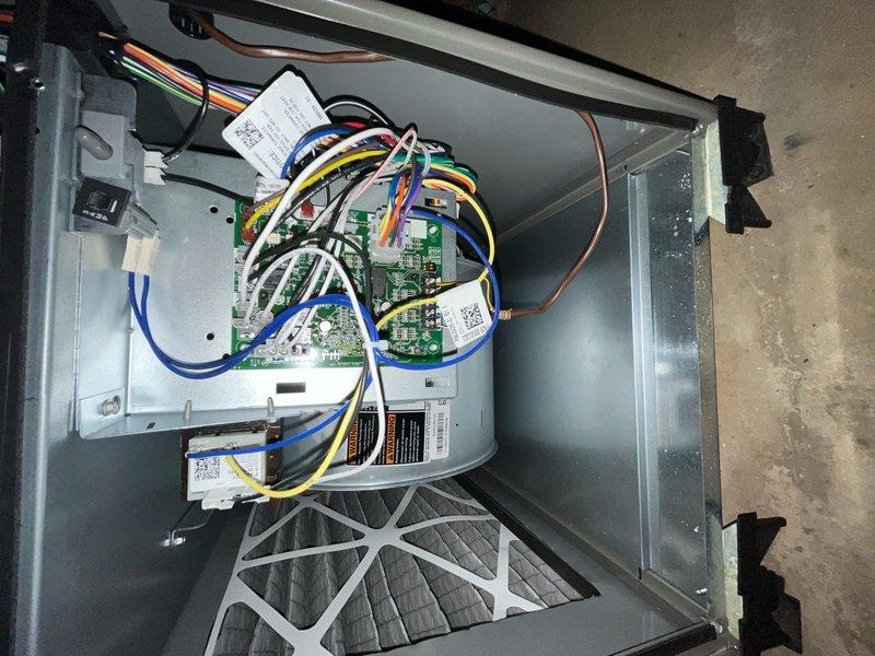 Performed comprehensive cooling season tune-up on 1-year-old residential air conditioning system. Inspected indoor air handler components including control board, wiring connections, and blower assembly; verified proper air filter installation and airflow. Conducted outdoor condenser unit inspection with coil exposure for cleaning assessment, checked refrigerant line connections, and evaluated overall system operation to ensure optimal cooling performance for the season.