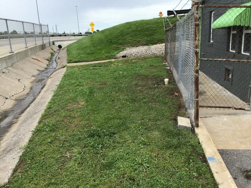 Responded to commercial property for main drain stoppage. Located cleanout access point in exterior area near chain-link fence line. Successfully cabled main drain line to clear obstruction and restore proper flow. Tested system to confirm drainage restored to normal operation. Photographed work area and cleanout location for service documentation.