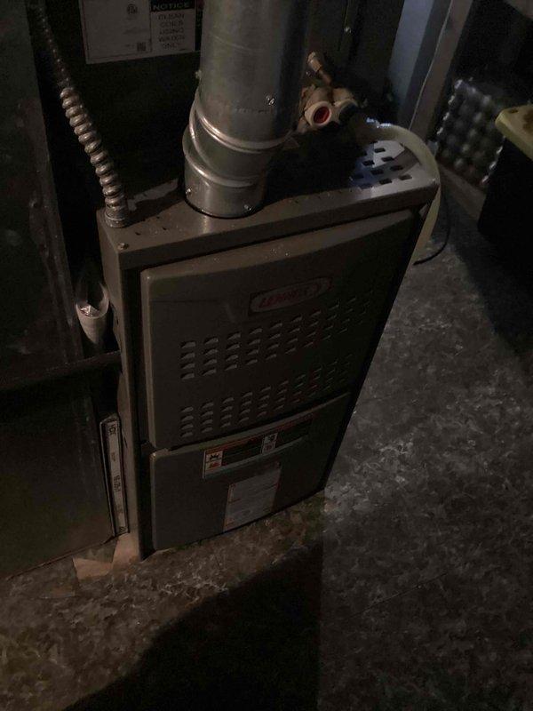 Completed comprehensive tune-up service on a Lennox 13ACXN042 split system air conditioning unit utilizing HFC-410A refrigerant. Performed standard preventive maintenance procedures including inspection of outdoor condensing unit and indoor furnace/air handler components, verified system operation, and documented equipment specifications and serial numbers for service records.