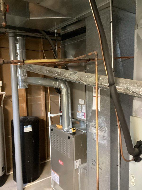 Completed comprehensive cooling tune-up and preventive maintenance on two residential air conditioning units located at the outdoor unit on the side of home and basement furnace/air handler system. Performed multi-point inspection including refrigerant level verification, electrical connection testing, condenser coil cleaning, air filter evaluation, condensate drain line inspection, and thermostat calibration on both units to ensure optimal system performance for the cooling season.