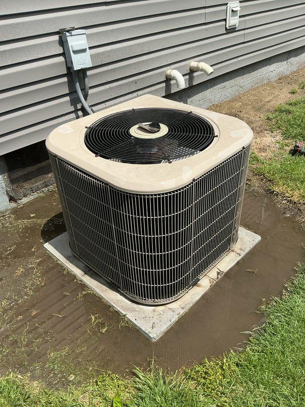 Completed comprehensive cooling season tune-up on 22-year-old Amana air conditioning system. Performed full system inspection including blower motor assembly, electrical connections, and outdoor condenser unit. Verified all wiring connections at junction box, inspected blower housing and motor operation, and evaluated outdoor unit condition including fan operation and coil accessibility. System operating within normal parameters upon completion of maintenance service.