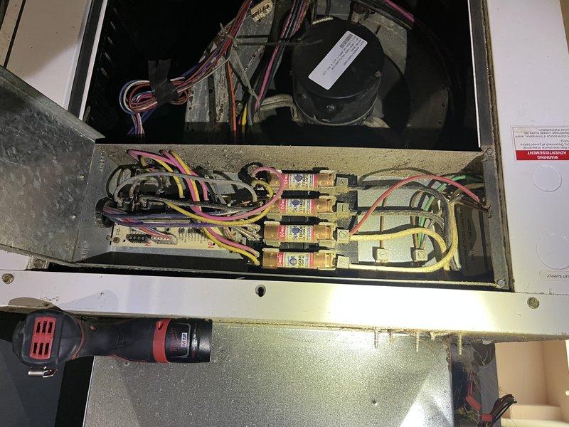 Performed diagnostic evaluation on 10-year-old geothermal system located in basement. Accessed electrical control panel and inspected internal components including circuit breakers, wiring connections, and motor assembly. Measured and documented system temperatures using calibrated digital thermometer, recording 66.2°F reading at floor level. Inspected electrical connections, capacitor, and control circuitry for proper operation and signs of wear or failure.