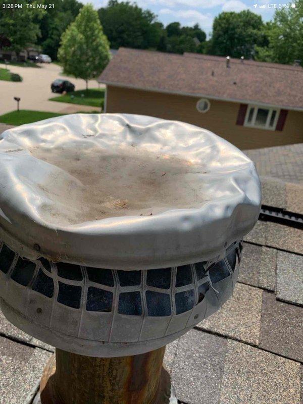 Responded to service call for 9-year-old residential air conditioning system following home inspection report indicating insufficient temperature differential of 11 degrees versus required minimum of 17 degrees. Inspected outdoor condensing unit and identified bent components affecting airflow and system performance. Examined rooftop ventilation cap and confirmed damage as noted in inspection report, with deteriorated flexible rubber cap showing signs of wear and improper sealing. Documented all findings with photographs for reference. System requires component repair or replacement to restore proper temperature differential and optimize cooling efficiency.