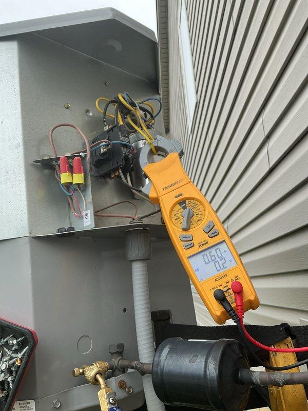 Completed comprehensive tune-up service on residential air conditioning system located at exterior of home. Performed electrical diagnostics using digital multimeter to test voltage and amperage at disconnect box and contactor assembly, verified proper electrical connections and component operation. Inspected condenser unit including coils, refrigerant lines, and overall system condition to ensure optimal performance for cooling season.