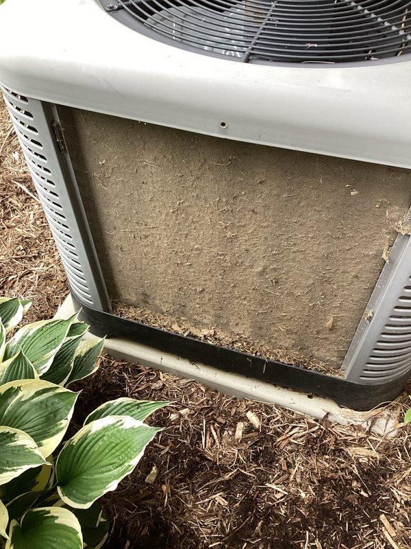 Responded to service call for 5-year-old Ruud system displaying "seek service" error and inadequate cooling. Upon inspection, discovered severely clogged air filter and condenser coil heavily contaminated with dust, dirt, and organic debris including leaves and plant matter. Removed and replaced dirty filter, thoroughly cleaned condenser coil fins and interior components, and cleared all debris from unit base and intake areas. Verified proper airflow restoration, cleared thermostat error code, and tested system operation to confirm full cooling capacity restored.