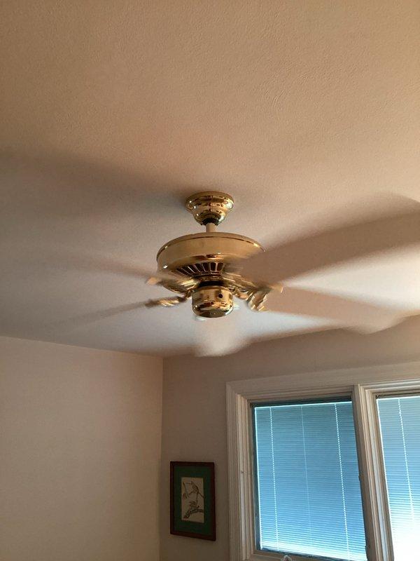 Responded to service call for ceiling fan with broken pull chain switch operating at maximum speed only. Inspected brass-finished ceiling fan with decorative housing and confirmed pull chain mechanism failure preventing speed control adjustment. Assessed fan motor housing and wiring connections to determine repair feasibility versus replacement options. Provided customer with evaluation findings and recommendations for restoring proper fan operation and speed control functionality.