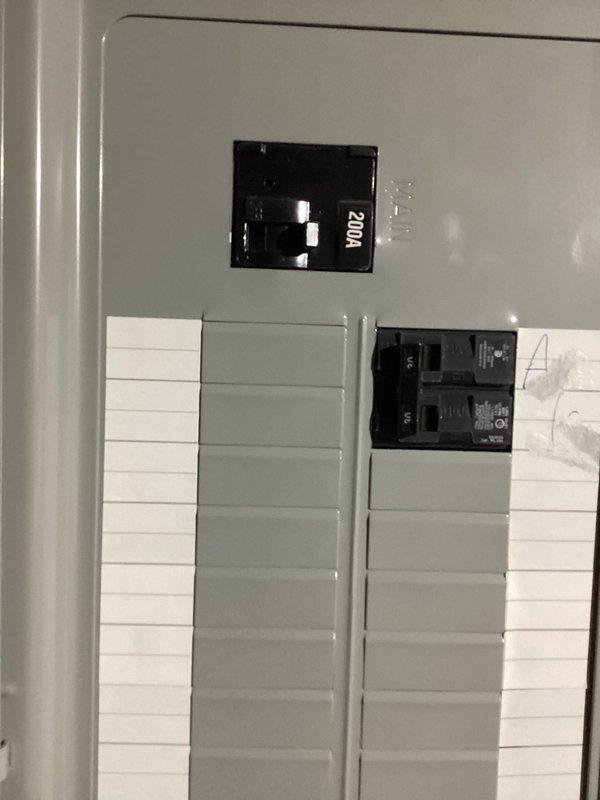 Completed electrical estimate for generator installation following HVAC technician turnover. Documented existing 200A main electrical panel with available breaker positions and assessed natural gas meter installation with supply piping configuration at exterior location. Photographed current utility infrastructure including gas meter assembly with shutoff valves, piping connections, and electrical service panel to determine equipment placement requirements and connection points for proposed generator system.