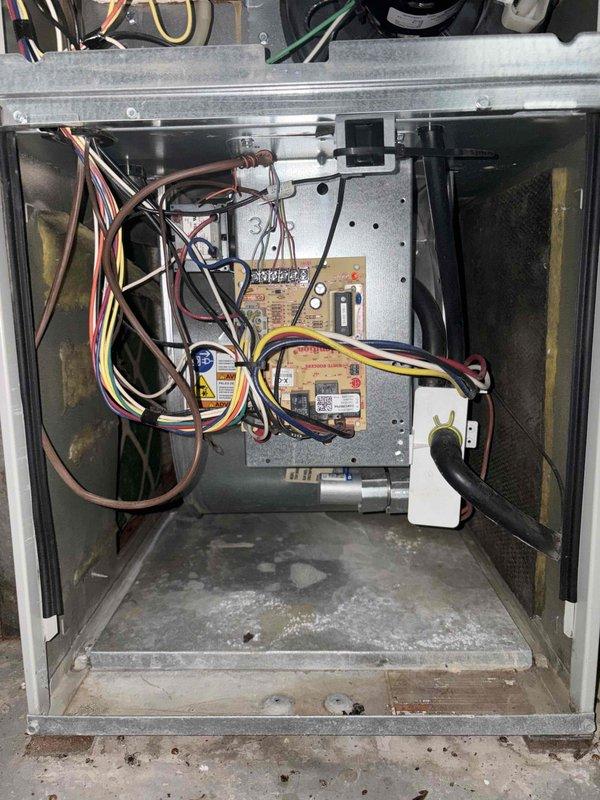 Completed cooling system evaluation on 13-year-old HVAC unit. Performed visual inspection of control cabinet, verifying electrical connections, control board operation, and capacitor condition. All components found operating within normal parameters with typical dust accumulation for unit age.