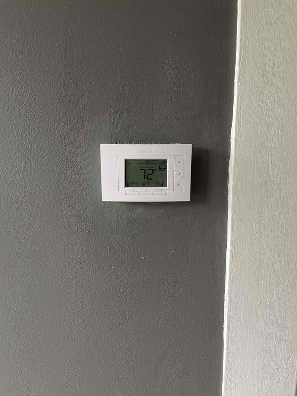 Installed new Sensi digital thermostat from truck stock to replace existing unit. Verified proper wiring connections at thermostat and control board terminals, confirmed system communication, and tested heating and cooling operation successfully.