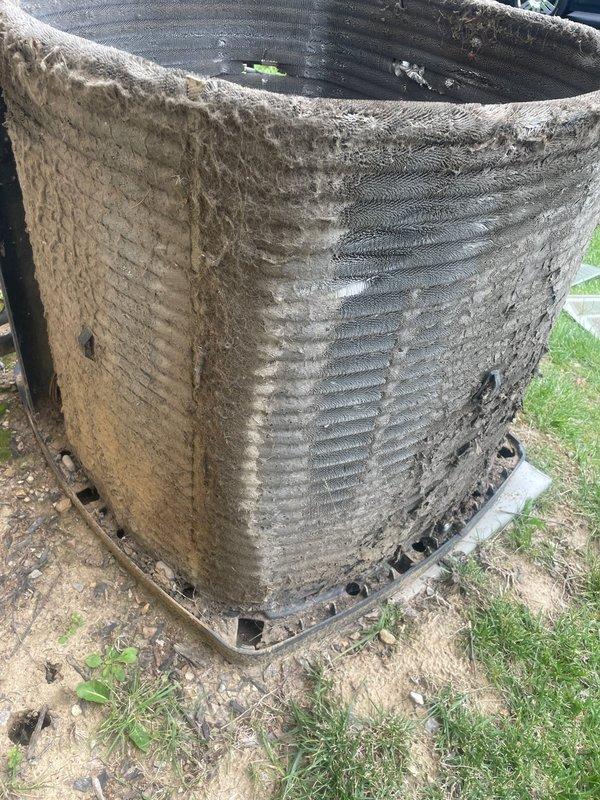 Replaced failed blower motor and wheel to restore airflow to second floor heating and cooling system. Installed new outdoor capacitor on heavily soiled condenser unit and performed thorough coil cleaning to remove extensive accumulation of dirt, dust, and debris that had significantly reduced system efficiency. All replaced components were removed from site and system tested successfully upon completion.