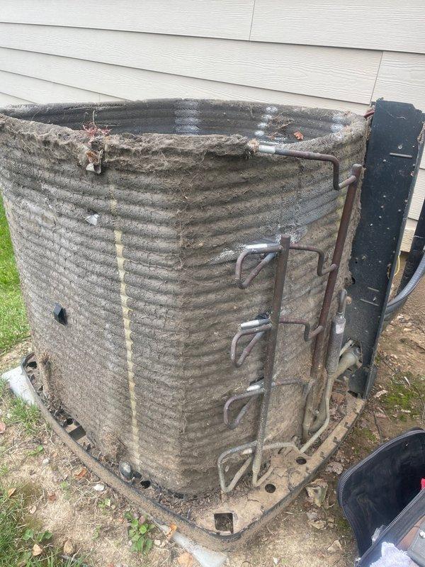 Replaced failed blower motor and wheel to restore airflow to second floor heating and cooling system. Installed new outdoor capacitor on heavily soiled condenser unit and performed thorough coil cleaning to remove extensive accumulation of dirt, dust, and debris that had significantly reduced system efficiency. All replaced components were removed from site and system tested successfully upon completion.