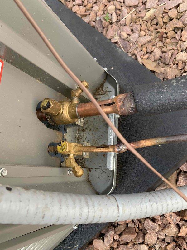 Responded to no cooling complaint on residential air conditioning system less than 10 years old located in side yard. Upon arrival, confirmed outdoor unit fan was operating but system was not producing cool air. Performed diagnostic evaluation of refrigeration circuit and electrical components. Inspected indoor evaporator coil, furnace connections, and associated copper line set for proper installation and refrigerant flow. Examined outdoor condensing unit service valves, brass fittings, and refrigerant connections for leaks or restrictions. Verified proper voltage and amperage to compressor and fan motor. System restored to normal cooling operation.