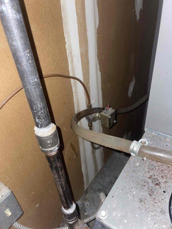 Responded to service call for air conditioning unit experiencing excessive water leakage on a six-year-old system. Upon arrival, performed diagnostic inspection of the indoor air handler and condensate drainage system. Found the primary condensate drain line was completely blocked, causing water to overflow from the drain pan. Cleared the obstruction using appropriate drain cleaning methods and verified proper drainage flow. Inspected the condensate pump, drain pan, and associated piping for damage or additional issues. Tested the system operation to confirm proper condensation removal and verified no further leaking occurred. Unit restored to normal cooling operation with proper water drainage functionality.