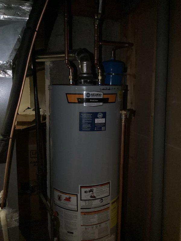Installed a new 40-gallon tall gas water heater in basement utility area, including all necessary plumbing connections with copper piping, thermal expansion tank, and required safety valves. Unit was properly vented, tested for proper operation, and all connections were verified leak-free upon completion.