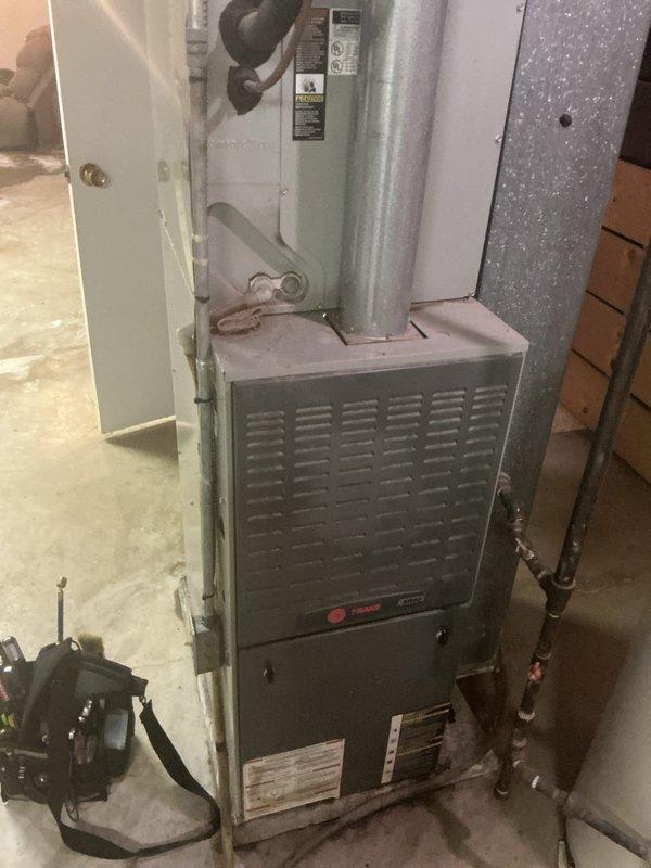 Responded to no cooling complaint on 24-year-old residential split system with Trane furnace and outdoor condenser unit. Upon arrival, customer reported system blowing warm air. Performed diagnostic evaluation of both indoor air handler and outdoor condensing unit. Inspected refrigerant lines, electrical connections, and overall system operation to identify root cause of cooling failure. Due to advanced age of equipment (24 years), discussed system condition and repair versus replacement options with customer for informed decision-making on next steps.