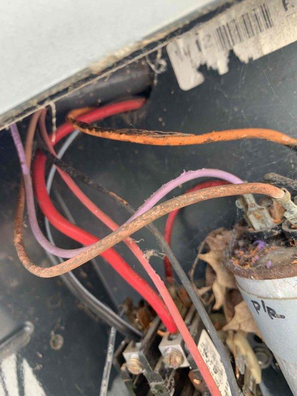 Completed comprehensive cooling system tune-up on 2003 outdoor AC unit. System diagnostics revealed severely corroded orange wire at capacitor requiring immediate attention for safe operation. Recorded refrigerant pressures and temperatures using digital manifold gauges, with suction side reading 125.7 PSIG and discharge side reading 218.1 PSIG. All measurements documented and system evaluated for proper operation and efficiency.