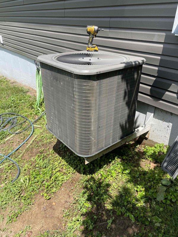 Completed comprehensive cooling tune-up on 8-year-old residential air conditioning system located at exterior of home. Performed full system inspection including electrical component testing, capacitor evaluation, refrigerant level verification, and condenser coil assessment. All components found operating within normal parameters; system cleaned, tested, and left in proper working condition.