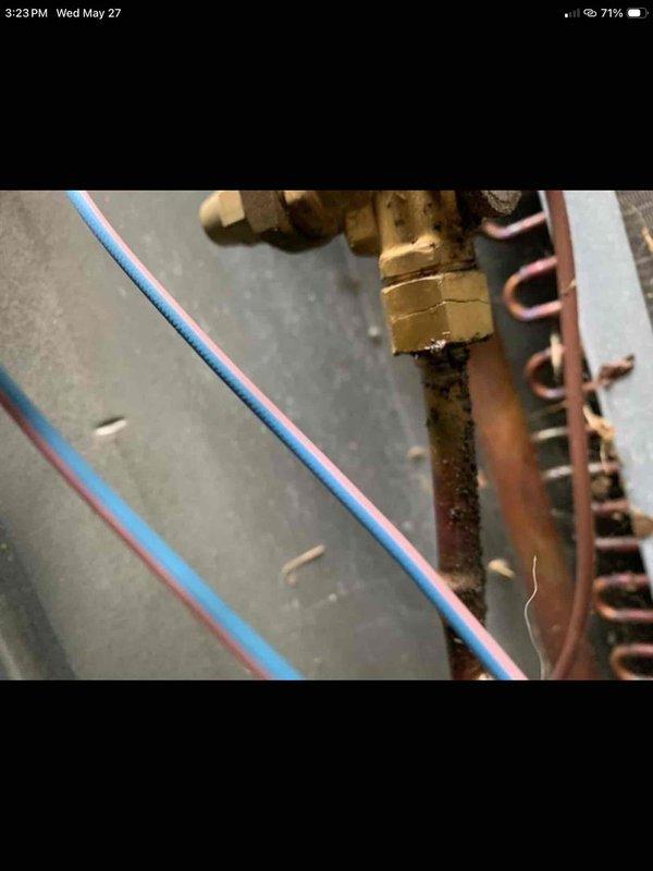 Responded to callback for second HVAC unit not reaching set temperature after previous diagnostic visit. Upon arrival, discovered unit was not originally installed by our company, which explained persistence of cooling issues. Performed thorough inspection of 2024-manufactured system, documenting existing installation conditions including copper refrigerant lines, coil configuration, and connection points. Photographed corroded brass fittings, aged copper piping with visible wear patterns, and system components showing signs of improper installation or maintenance. Advised customer of findings and recommended next steps for resolution.
