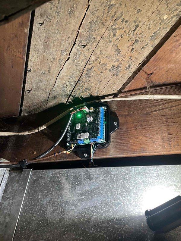 Responded to recall on unit under one year old reported as not kicking on. Upon arrival, inspected system and control board mounted in attic space. Verified all electrical connections at circuit board terminal block were secure, checked wire terminations, and confirmed proper mounting of control assembly. Tested system operation and verified unit cycled properly with no further issues observed.