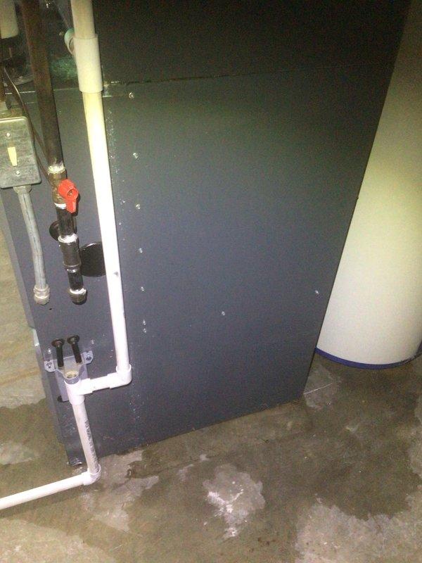 Responded to emergency call regarding water heater failure and potential furnace damage in basement. Upon arrival, found standing water on concrete floor from failed water heater. Performed thorough inspection of 10-year-old furnace system, including control board, wiring connections, and all electrical components. Examined control module with heat sink fins and verified all wire connections were secure and undamaged. Found no water intrusion to furnace components and confirmed system was not affected by water heater failure. Tested furnace operation and verified proper function of all safety controls and ignition sequence. Documented conditions with photos showing control board installation and basement water damage from separate water heater issue. Advised on water cleanup needs and confirmed furnace system remains operational and does not require replacement at this time.