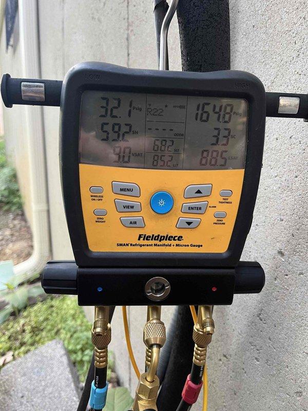 Responded to no cooling complaint on 15-year-old ground-level unit running constantly and blowing warm air. Upon inspection, found severely clogged air filter restricting airflow, causing reduced system efficiency and inadequate cooling. Replaced dirty filter with new unit. Performed system diagnostics using refrigerant manifold gauge set to verify proper refrigerant pressures, temperatures, and overall system performance. Confirmed unit operating within normal parameters following filter replacement. System restored to proper cooling operation.