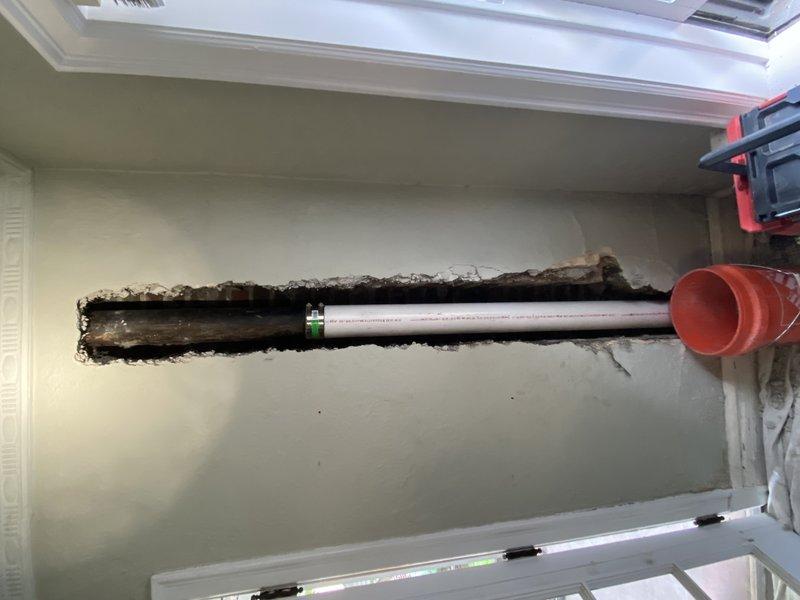 Removed damaged cast iron stack from basement floor to ceiling level after camera inspection identified crack in pipe. Installed new PVC stack piping with proper fittings and supports, created access opening through drywall and decorative molding to reach affected section. Tested all connections for leaks upon completion to ensure system integrity.