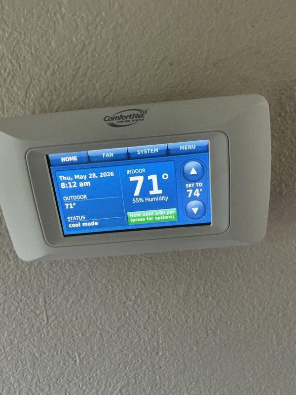 Completed preventive maintenance tune-up on an 8-year-old residential cooling system. Inspected indoor air handler components including blower motor, control boards, capacitors, and electrical connections; verified proper operation of ComfortNet thermostat set to cool mode with system holding at 74°F setpoint. Checked outdoor condensing unit, confirmed all system parameters within normal operating range, and ensured unit is ready for continued reliable cooling performance.