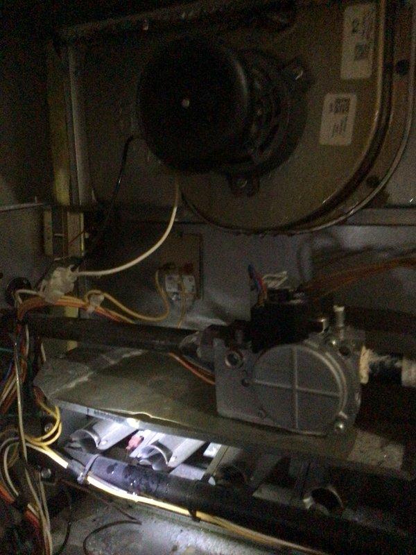 Responded to no-cooling emergency call for Goodman system running continuously without cooling the home. Upon inspection, accessed control board and internal components to diagnose the issue. Performed troubleshooting of electrical connections, control circuit, and system operation. Inspected blower motor assembly, gas valve connections, and associated wiring harnesses for proper function. Documented system conditions with photos of control board wiring and internal mechanical components for service records.