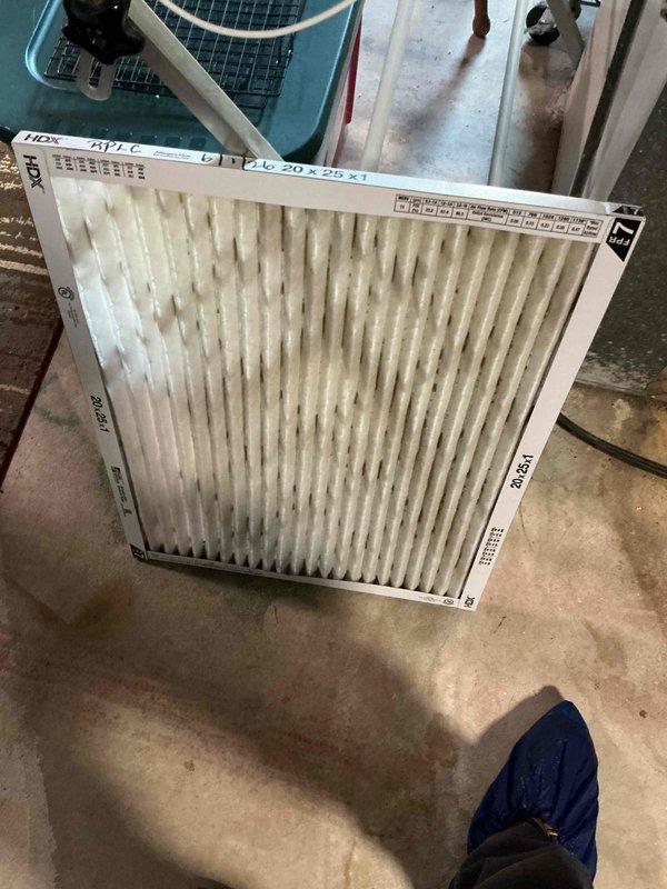 Completed comprehensive cooling maintenance tune-up on 9-year-old air conditioning system. Replaced heavily soiled indoor air filter that showed significant dust and debris accumulation throughout pleated media. Cleaned exterior condenser coils which displayed substantial dirt buildup with particulate matter caked in corrugated fins, restricting airflow and reducing heat transfer efficiency. System tested and confirmed operational upon completion of maintenance service.