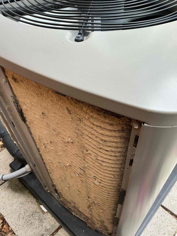 Completed comprehensive cooling maintenance tune-up on 9-year-old air conditioning system. Replaced heavily soiled indoor air filter that showed significant dust and debris accumulation throughout pleated media. Cleaned exterior condenser coils which displayed substantial dirt buildup with particulate matter caked in corrugated fins, restricting airflow and reducing heat transfer efficiency. System tested and confirmed operational upon completion of maintenance service.