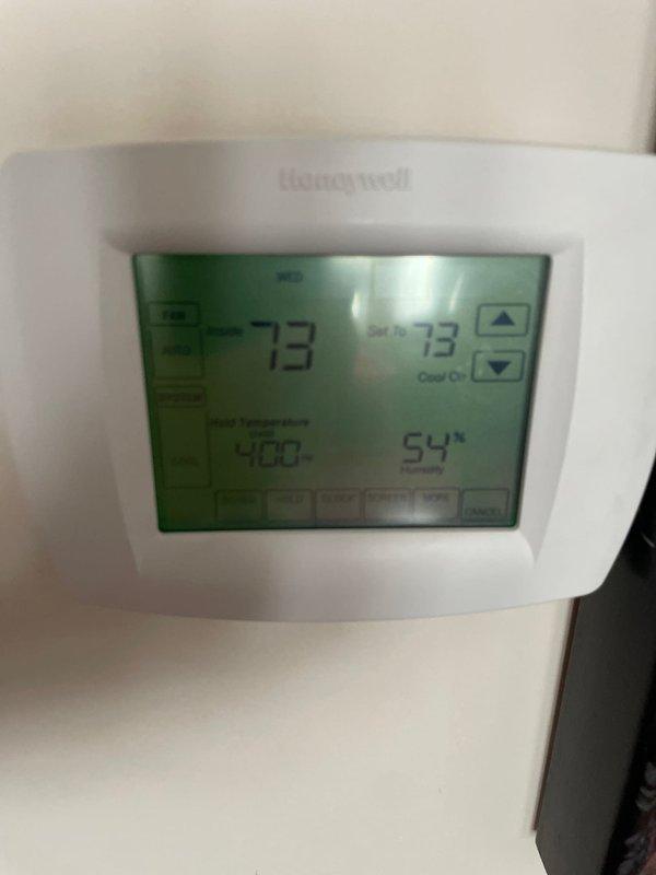 Completed scheduled cooling maintenance tune-up on residential HVAC system. Performed comprehensive inspection of air handler unit and verified Honeywell thermostat operation displaying 73°F in cooling mode. System tested and confirmed operating properly with all components functioning as designed.