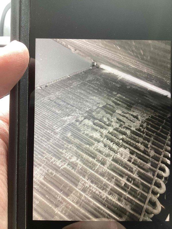 Completed installation of blue condensate drain tubing and performed thorough cleaning of evaporator coil. Routed new drain line through wall cavity alongside existing utility infrastructure and secured properly with mounting clips. Evaporator coil was cleaned to restore optimal heat transfer efficiency and system performance.