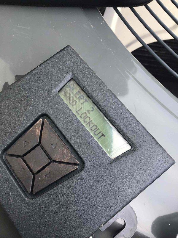 Responded to service call for 4-year-old ground-level unit displaying error codes 184.07 and 24.08 with complete system failure. Upon arrival, confirmed thermostat was showing multiple alert messages and unit would not initiate startup sequence. Performed diagnostic testing using digital multimeter to check electrical components and control board functionality. Investigated error code 184.07 indicating communication fault and error code 24.08 related to system lockout condition. Examined thermostat control interface and verified display was actively showing Alert 3 status with system unable to call for cooling. Checked wiring connections between thermostat and air handler, inspected control board for visible damage or failed components, and tested voltage supply to ensure proper power delivery. Documented equipment conditions with photographs showing diagnostic meter readings and thermostat error display for service records. Unit requires further technical evaluation to isolate root ca