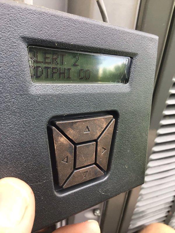 Responded to service call for 4-year-old ground-level unit displaying error codes 184.07 and 24.08 with complete system failure. Upon arrival, confirmed thermostat was showing multiple alert messages and unit would not initiate startup sequence. Performed diagnostic testing using digital multimeter to check electrical components and control board functionality. Investigated error code 184.07 indicating communication fault and error code 24.08 related to system lockout condition. Examined thermostat control interface and verified display was actively showing Alert 3 status with system unable to call for cooling. Checked wiring connections between thermostat and air handler, inspected control board for visible damage or failed components, and tested voltage supply to ensure proper power delivery. Documented equipment conditions with photographs showing diagnostic meter readings and thermostat error display for service records. Unit requires further technical evaluation to isolate root ca