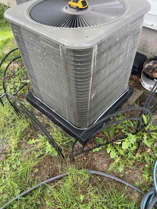 # HVAC Cooling System Maintenance Summary

Completed comprehensive cooling maintenance tune-up on residential outdoor condenser unit. System was found operational upon arrival and remained in working condition throughout service. Performed standard preventative maintenance procedures including inspection of condenser cabinet, electrical components, and capacitor. Verified proper wiring connections and electrical safety. Unit is functioning as designed with no issues identified.

# Detailed Service Description

Performed routine cooling maintenance on residential split system air conditioning unit. Upon arrival, confirmed system was operational and in cooling mode. Conducted thorough visual inspection of outdoor condenser unit positioned on elevated metal stand.

Removed access panel to inspect internal electrical compartment. Examined all electrical connections including red, yellow, black, green, and purple wire terminations for security and proper contact. Inspected cylindrical capac