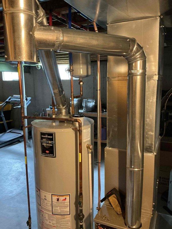 Completed repair of damaged flue pipe system for water heater and HVAC equipment. Replaced deteriorated sections with new 4" ductwork components, including one elbow fitting and three straight pipe sections. All connections were properly secured and sealed to ensure safe exhaust ventilation, and system was tested to verify proper operation.