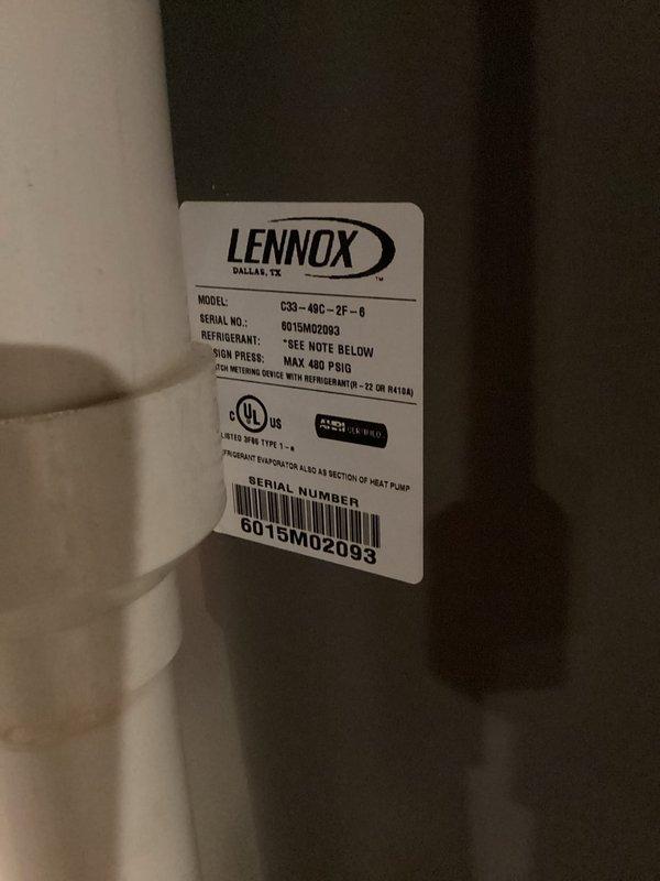 Completed preventative maintenance tune-up on an 11-year-old Lennox condenser unit (Model C33-40C-2F-6, Serial 6015M02093) located in side yard. Performed comprehensive system inspection including cleaning condenser coils, checking refrigerant levels and pressures, testing electrical components, verifying proper airflow through fins, and ensuring unit operates within manufacturer specifications. Unit found to be in good operational condition with all components functioning properly.