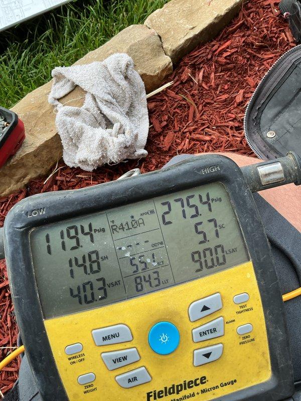 Completed comprehensive cooling system tune-up and maintenance on a 9-year-old air conditioning unit. Performed diagnostic testing using digital manifold gauges, recording refrigerant pressures with low side at 119.4 PSIG and high side at 275.4 PSIG, superheat at 14.8°F, and subcooling at 5.7°F. Inspected evaporator coil condition using thermal imaging tools and verified proper system operation with all parameters within acceptable ranges.