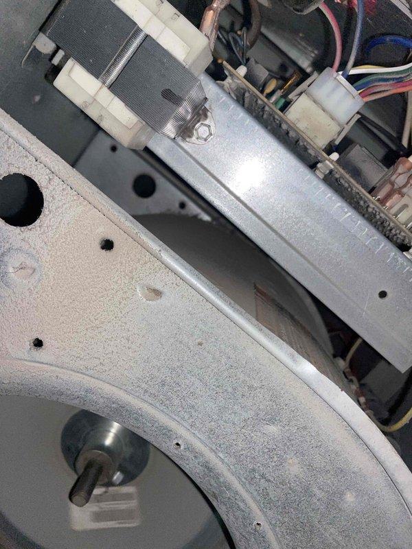 Completed comprehensive tune-up service on residential air conditioning system. Upon inspection, discovered significant frost and ice buildup on evaporator coil fins, indicating restricted airflow or potential refrigerant issue. Inspected blower assembly and internal air handler components, documenting condition of motor, wiring connections, and housing for maintenance records.