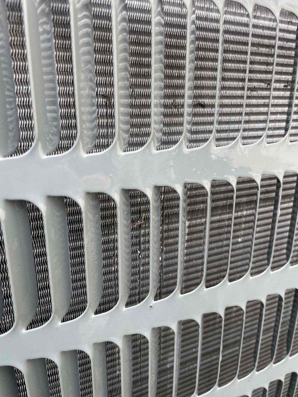 Completed comprehensive tune-up service on residential air conditioning system. Upon inspection, discovered significant frost and ice buildup on evaporator coil fins, indicating restricted airflow or potential refrigerant issue. Inspected blower assembly and internal air handler components, documenting condition of motor, wiring connections, and housing for maintenance records.