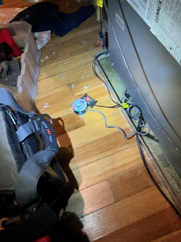 Responded to emergency service call for two 13-year-old attic-mounted air handlers experiencing drain pan overflow. Upon inspection, found both units' condensate drain lines were blocked, causing drain pans to fill and overflow overnight. Cleared obstructions from primary and secondary drain lines on both units, tested drainage flow with gauge equipment to verify proper operation, and confirmed pans were draining correctly before departure.