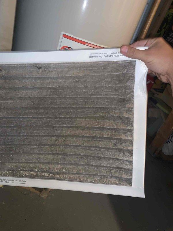Completed comprehensive tune-up maintenance on two residential AC units, both 5-10 years old and located at ground level on side of home. Performed standard preventive maintenance procedures including system inspection, cleaning, and testing on both units. Documented heavily soiled air filter requiring replacement due to significant dust and debris accumulation that could restrict airflow and reduce system efficiency.