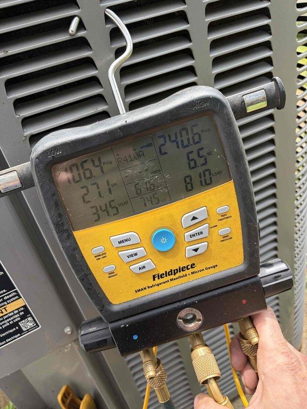 Responded to no cooling complaint on 12-year-old York system blowing warm air. Upon arrival, connected manifold gauges and found system operating with low suction pressure and excessive superheat, indicating refrigerant undercharge. Evaporator coil inspection revealed active condensation and proper airflow across fins. Diagnosed refrigerant leak as root cause of cooling loss. System requires leak detection, repair, evacuation, and refrigerant recharge to restore proper cooling operation. Documented system conditions with diagnostic readings and coil condition photos for reference.