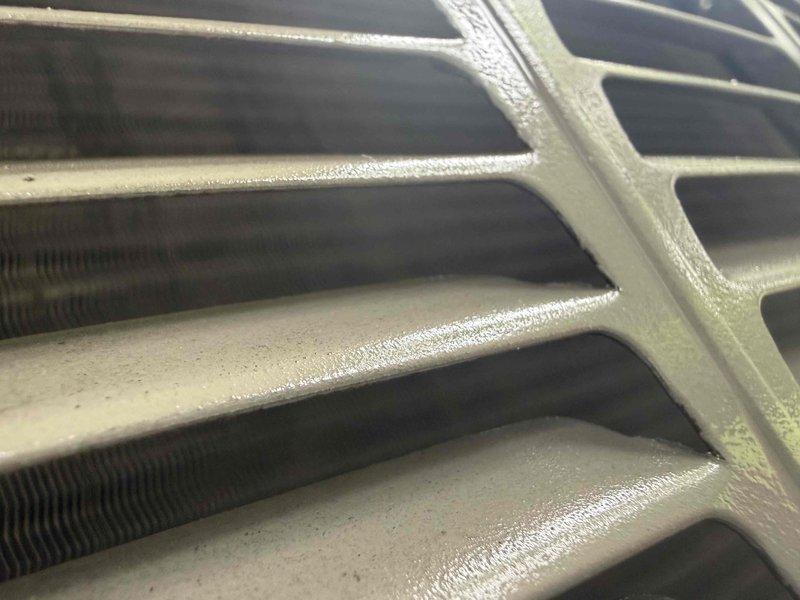 Responded to no cooling complaint on 12-year-old York system blowing warm air. Upon arrival, connected manifold gauges and found system operating with low suction pressure and excessive superheat, indicating refrigerant undercharge. Evaporator coil inspection revealed active condensation and proper airflow across fins. Diagnosed refrigerant leak as root cause of cooling loss. System requires leak detection, repair, evacuation, and refrigerant recharge to restore proper cooling operation. Documented system conditions with diagnostic readings and coil condition photos for reference.