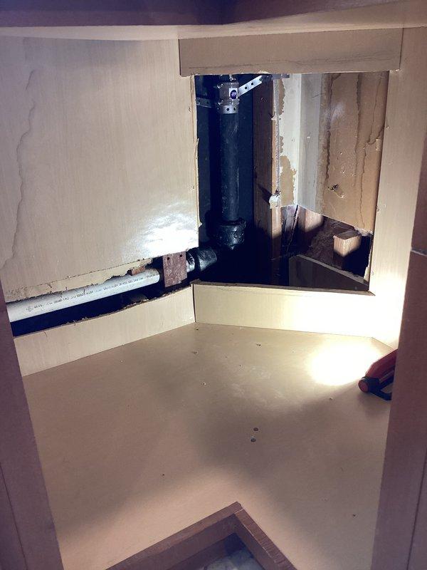 Completed final phase of permitted plumbing installation following drywall finishing work. Installed toilet fixture and applied caulking around base to ensure proper seal and finished appearance. Performed water test on drain stack to verify system integrity for municipal inspection compliance. Verified all rough-in plumbing connections, including vertical drain stack and associated trap assemblies beneath cabinet fixtures, were properly secured and functioning. This work fulfilled the remaining scope of the original estimate and brought the installation to completion per permit requirements.